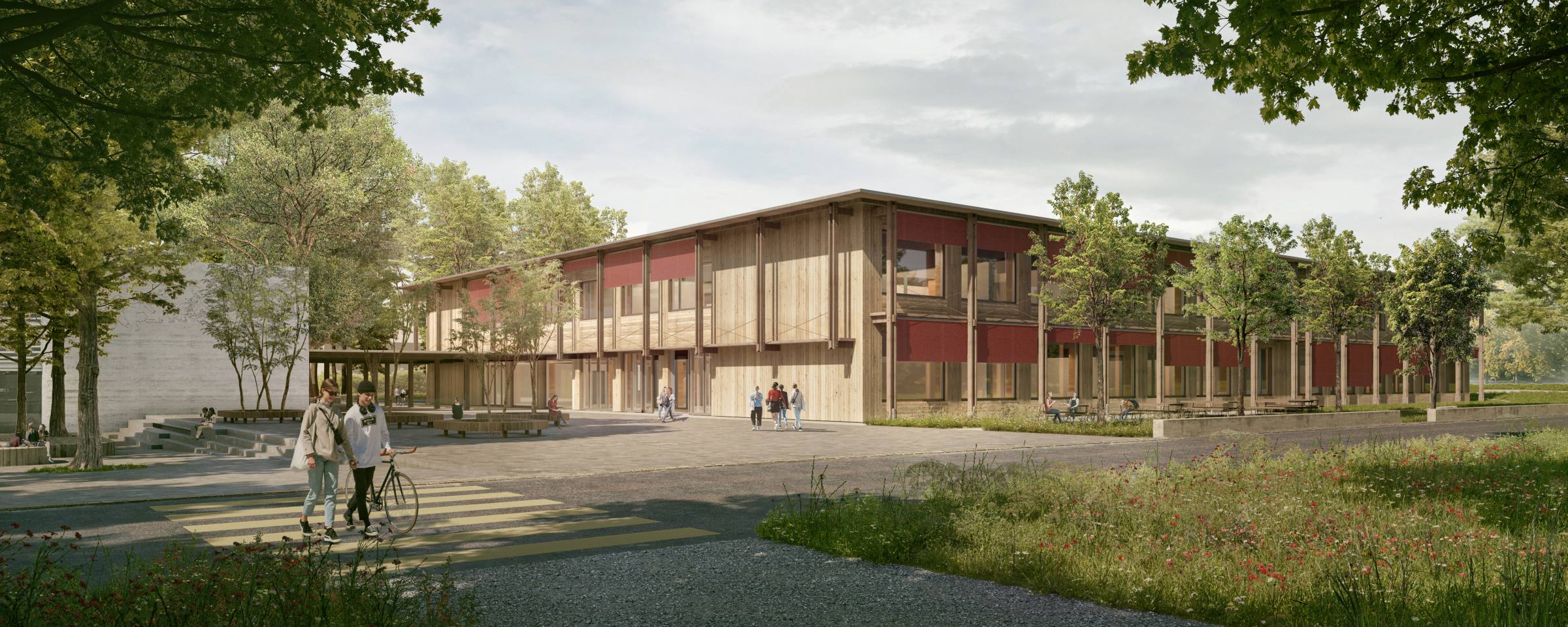 Blick von der Schulstrasse: Die Laubenkonstruktion aus Holz strukturiert und schützt die Fassade des neuen Schulhauses.