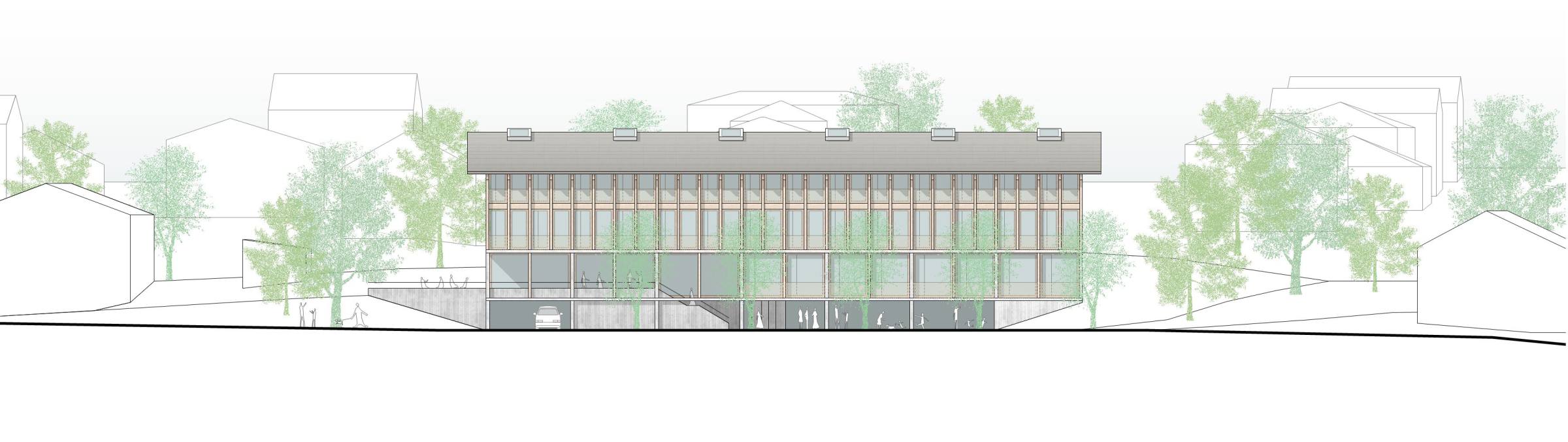 Façade ouest, côté rue: Au niveau de la place de l’entrée principale les salles communes se tournent vers le village avec de larges fenêtres ; on y voit quand il se passe quelque chose à l'intérieur.